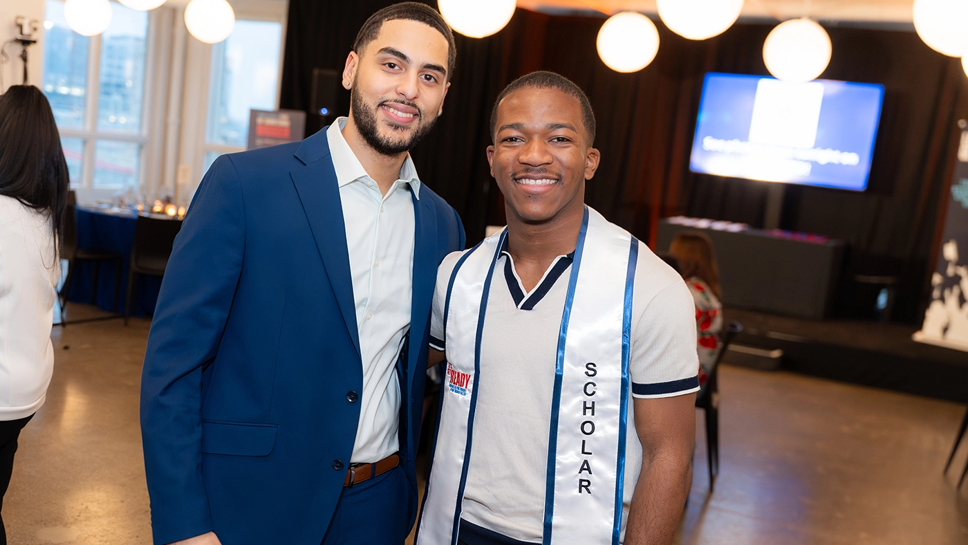 A Let's Get Ready scholars poses with his mentor.